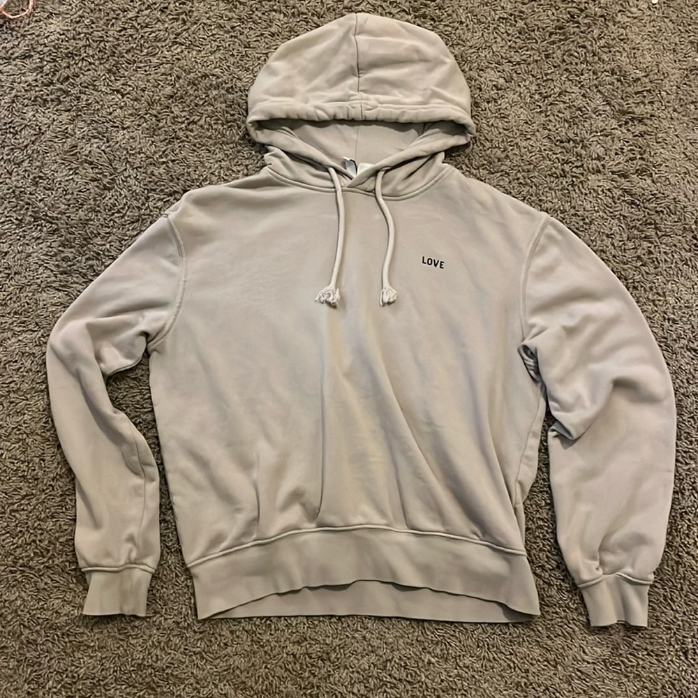tan sweatshirt that says love on it